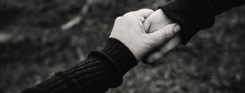 black and white photo of holding hands 735978